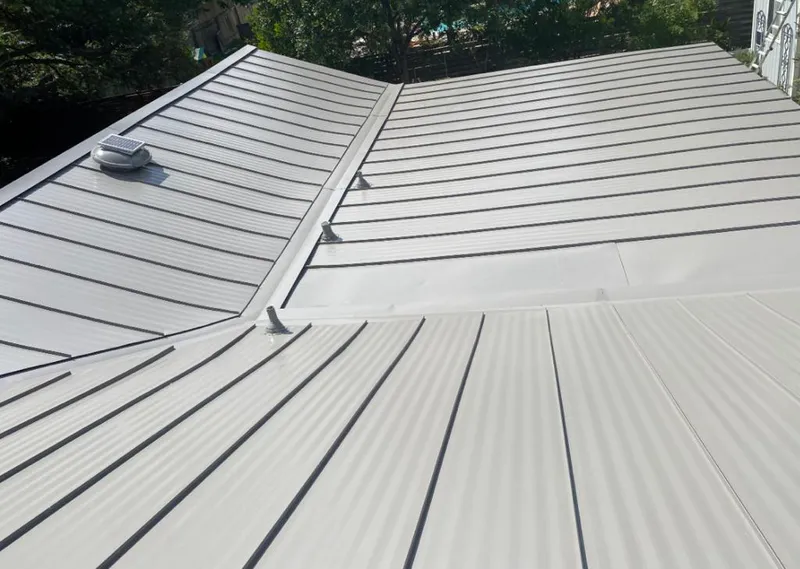 Solar attic fan installed on a metal roof for Roof Ventilation in Linganore